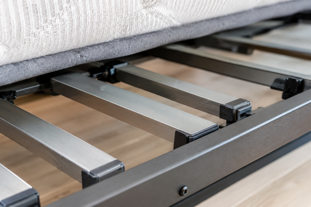 "Close-up of metal slat support system on the Cargo full bed frame, no box spring needed