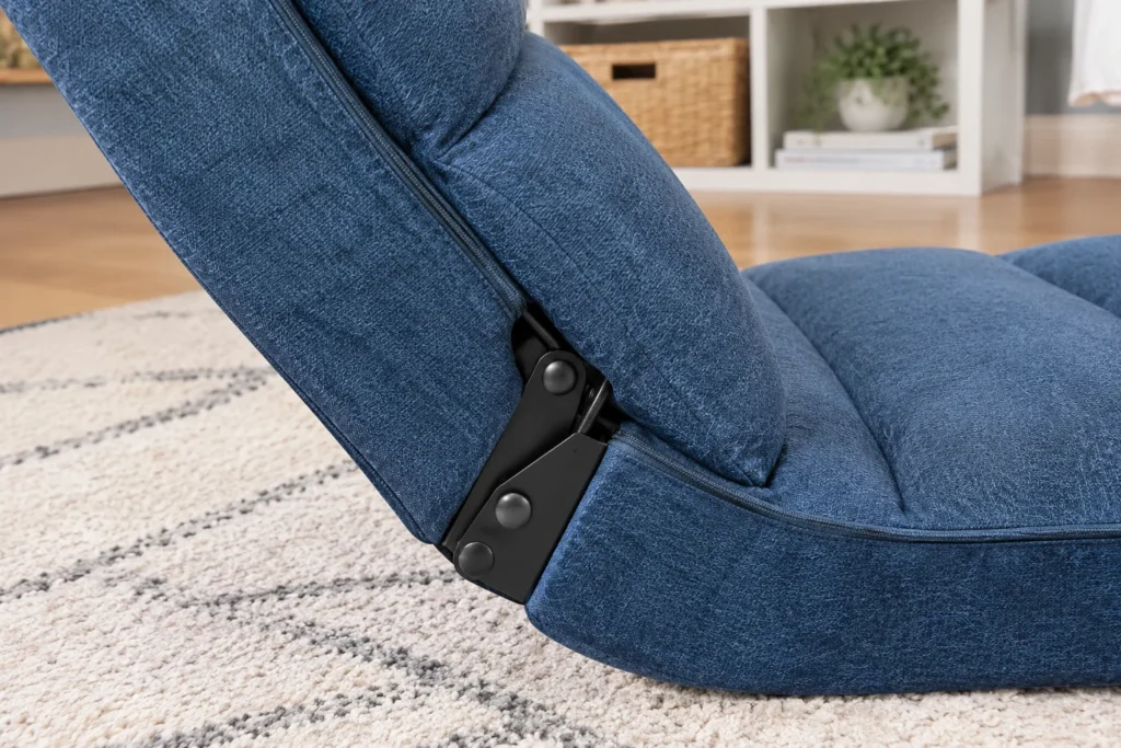 Close-up of the folding hinge mechanism on the Ebern Designs floor game chair.