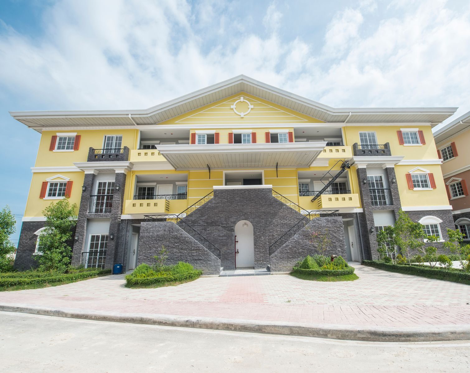 Explore this stunning yellow residential building in Cebu City, showcasing modern architecture and vibrant design.
