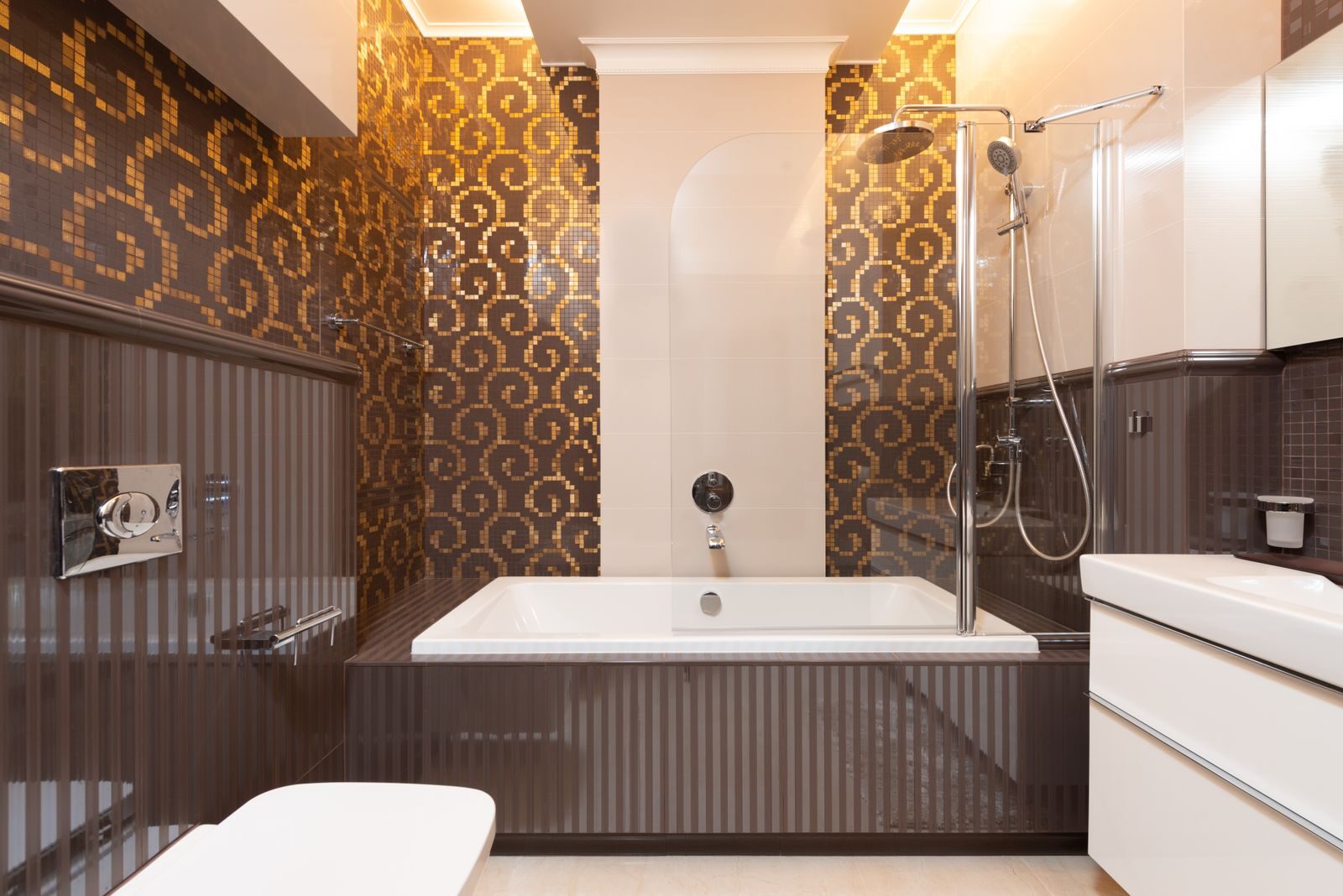 Elegant bathroom featuring a bathtub and mosaic-tiled walls in a contemporary design.