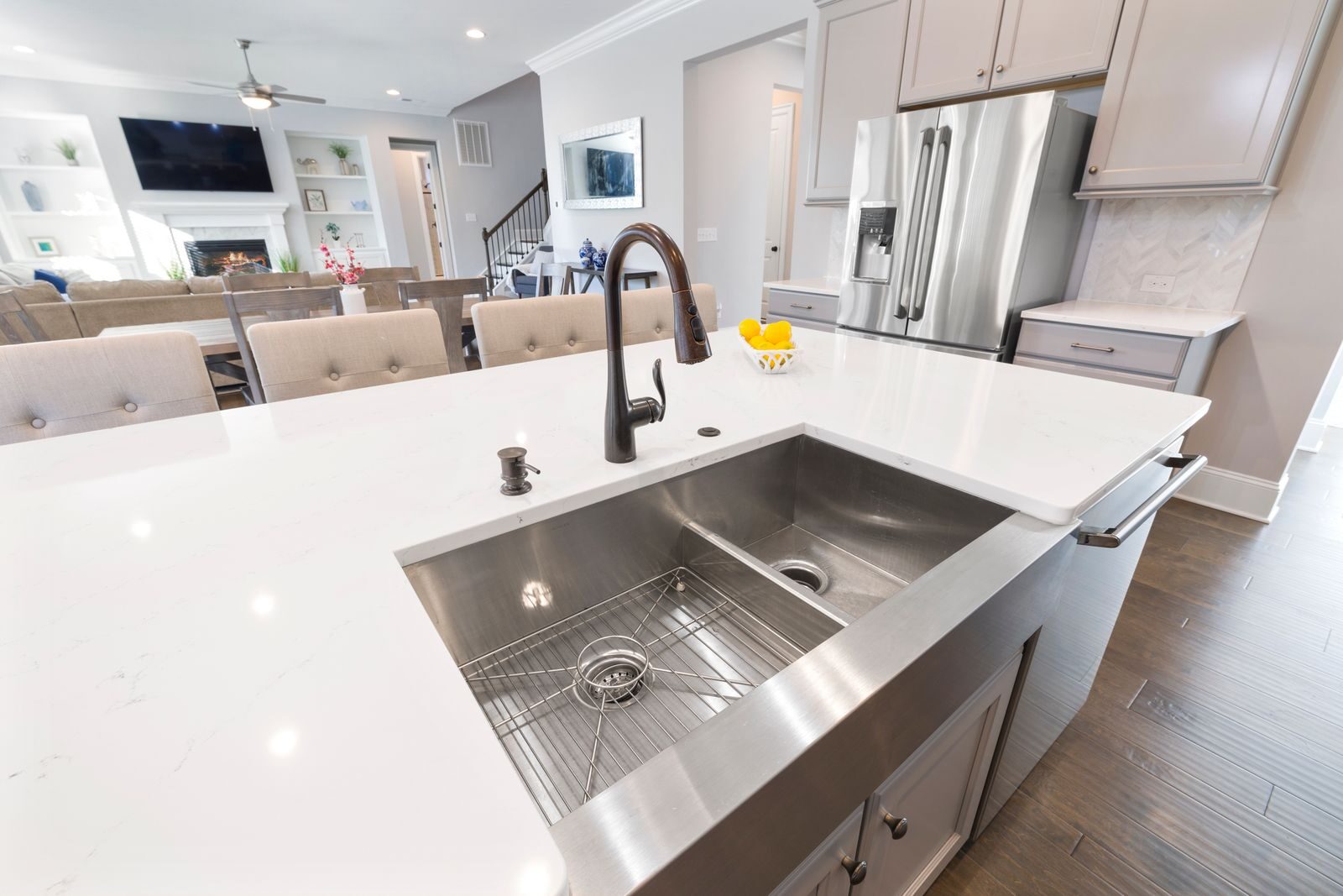 Spacious kitchen featuring a marble countertop and stainless steel sink, ideal for modern home interiors.