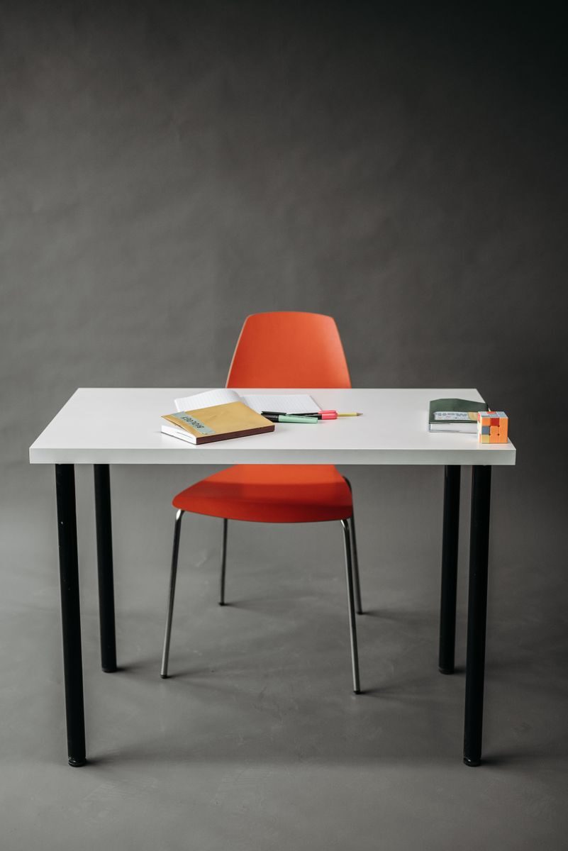"Jonti-Craft Berries Rectangle Student Desk 24x30 in a bright modern classroom, featuring a durable laminate tabletop, sturdy steel legs, rounded safety corners, and a spacious learning workspace for students."