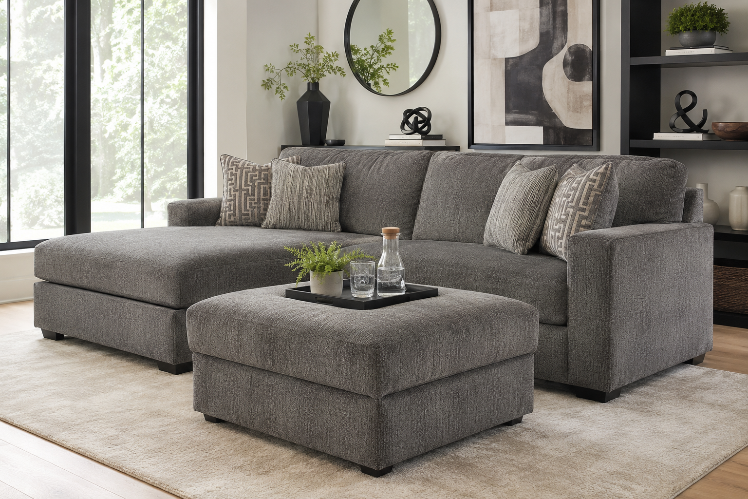 Ashley Altari 2-piece sectional with ottoman in a modern gray living room, featuring plush seating and contemporary decor.