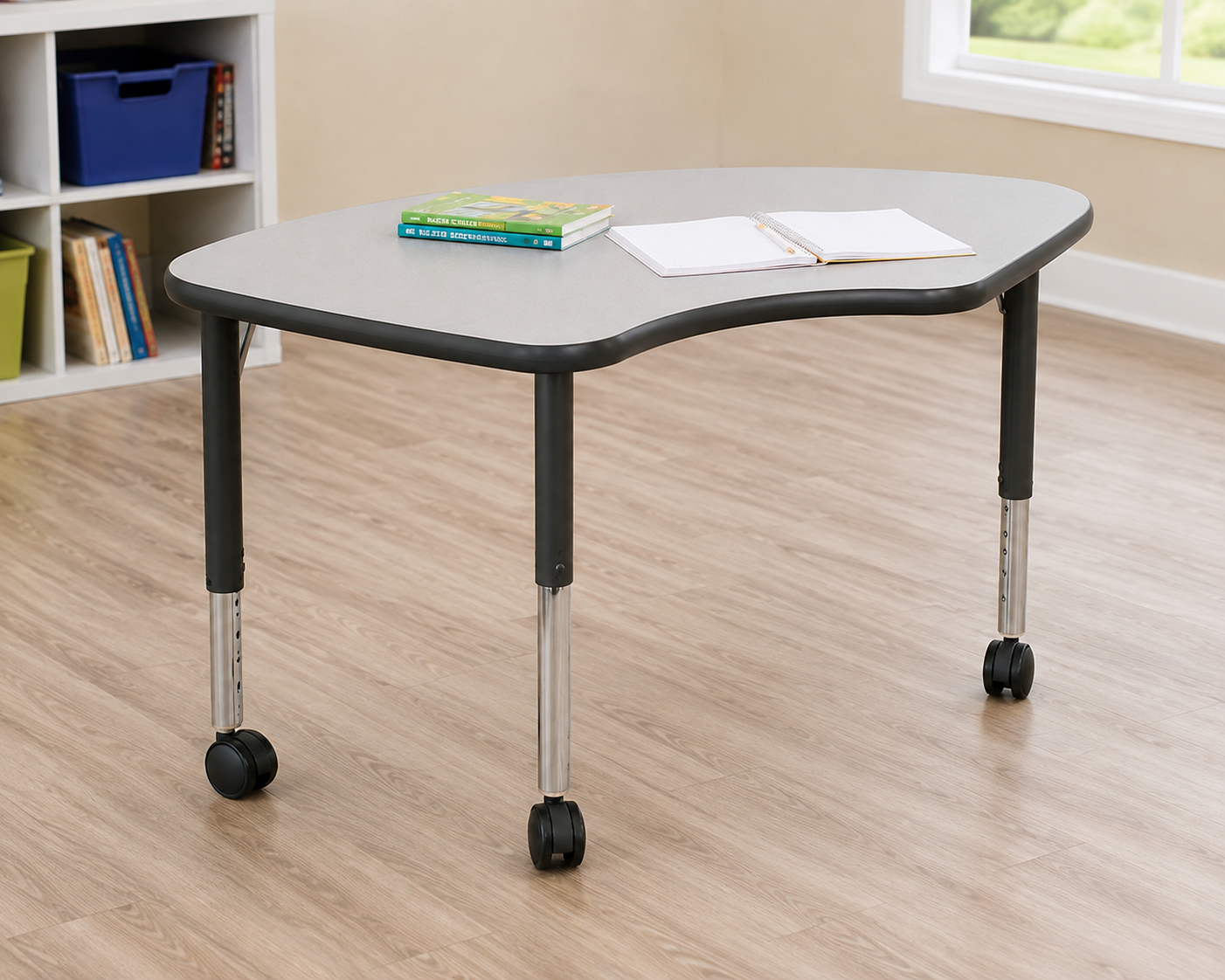 AmTab FishDesk2433 collaborative learning desk with a spacious curved tabletop, adjustable legs, and rolling casters in a modern classroom.
