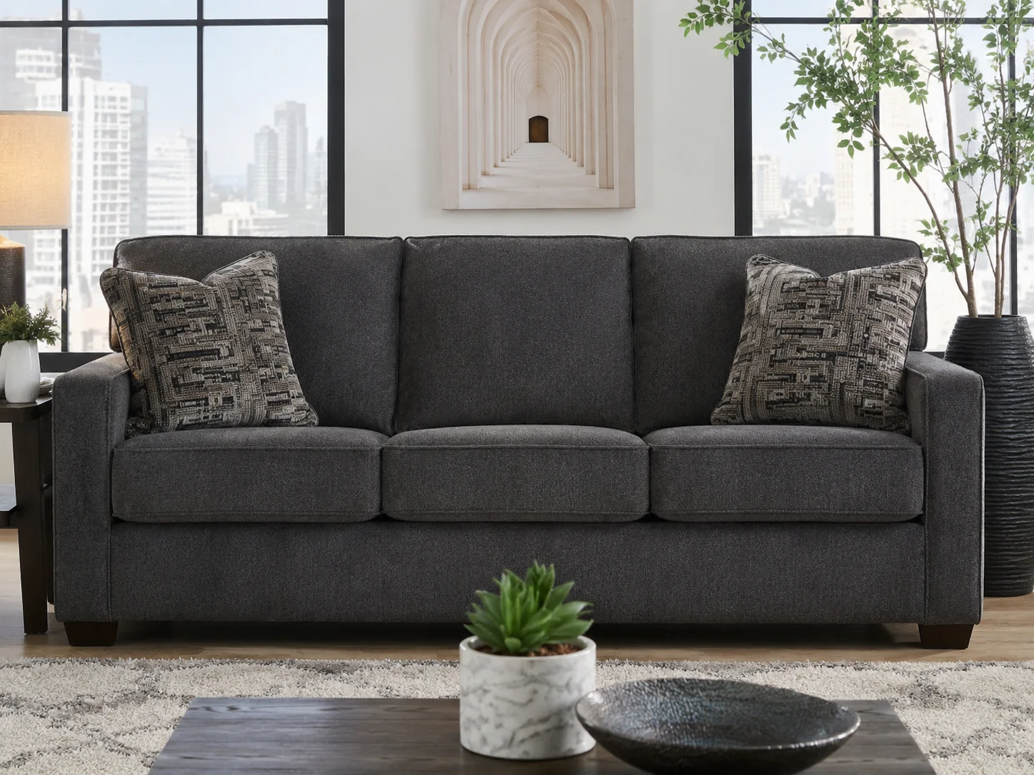 Ashley Adlai sofa in Shadow color with plush cushions and modern styling in a contemporary living room.