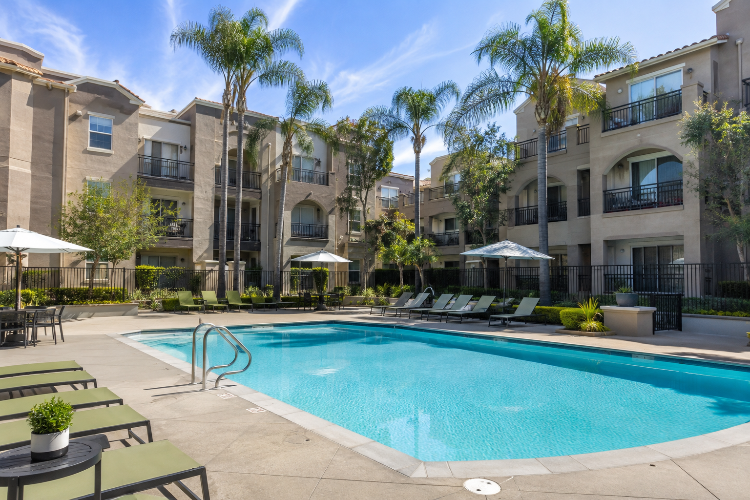 The Terrace Apartments at 200 City Blvd W in Orange, California, featuring a resort-style pool, palm trees, balconies, and landscaped courtyard.