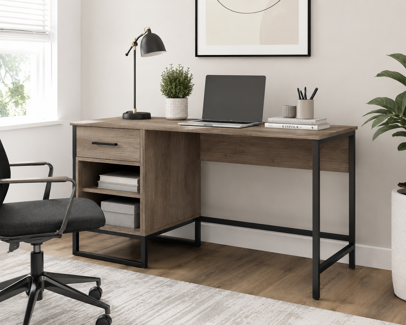 Corrigan Studio Nico Desk in a modern home office featuring a wood-grain desktop, black metal frame, drawer storage, open shelving, and a minimalist workspace ideal for studying, writing, and remote work.
