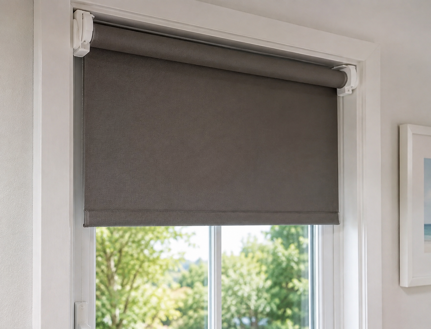 Realistic no drill roller blinds installed on a modern white-framed window using tool-free clip-on brackets in a bright contemporary home interior.