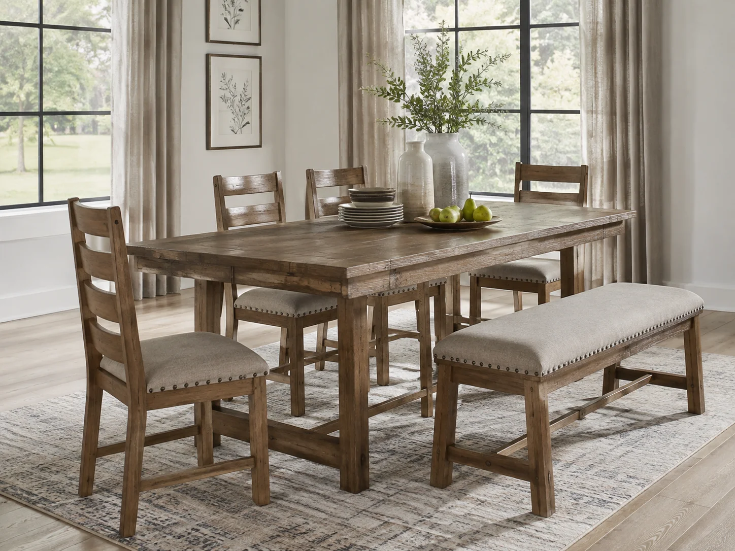 Ashley Woodanville dining table set with rustic wood table, upholstered chairs, and bench in a bright modern farmhouse dining room.