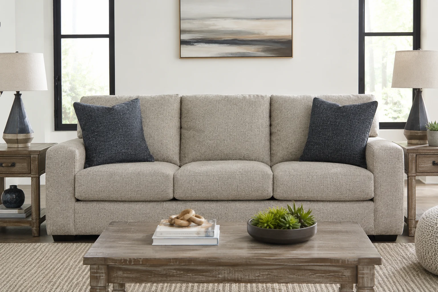 Ashley Kananwood sofa in a bright modern living room with neutral décor and a rustic wood coffee table