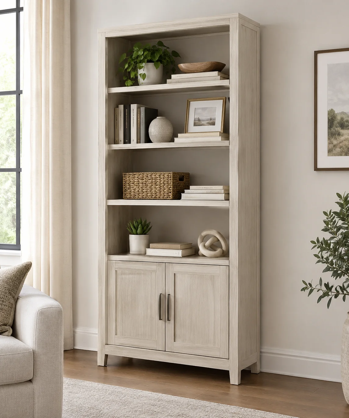 Ashley Kanwyn Whitewash Bookcase with open shelves styled with books and home decor