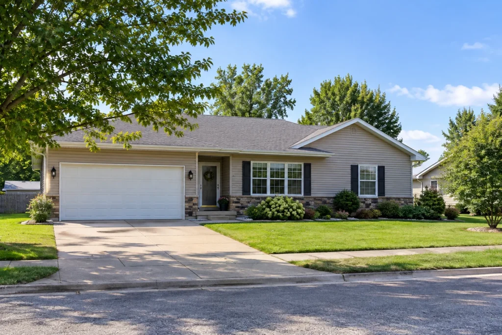 Single-story house with attached garage on a residential street in Wisconsin