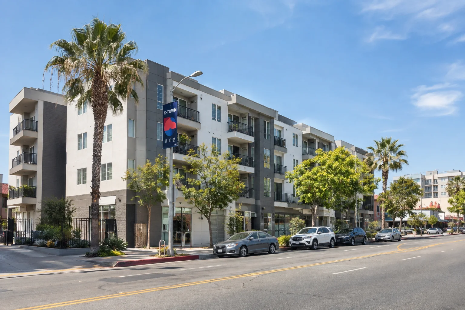 Mid-rise apartment buildings along a Los Angeles neighborhood street