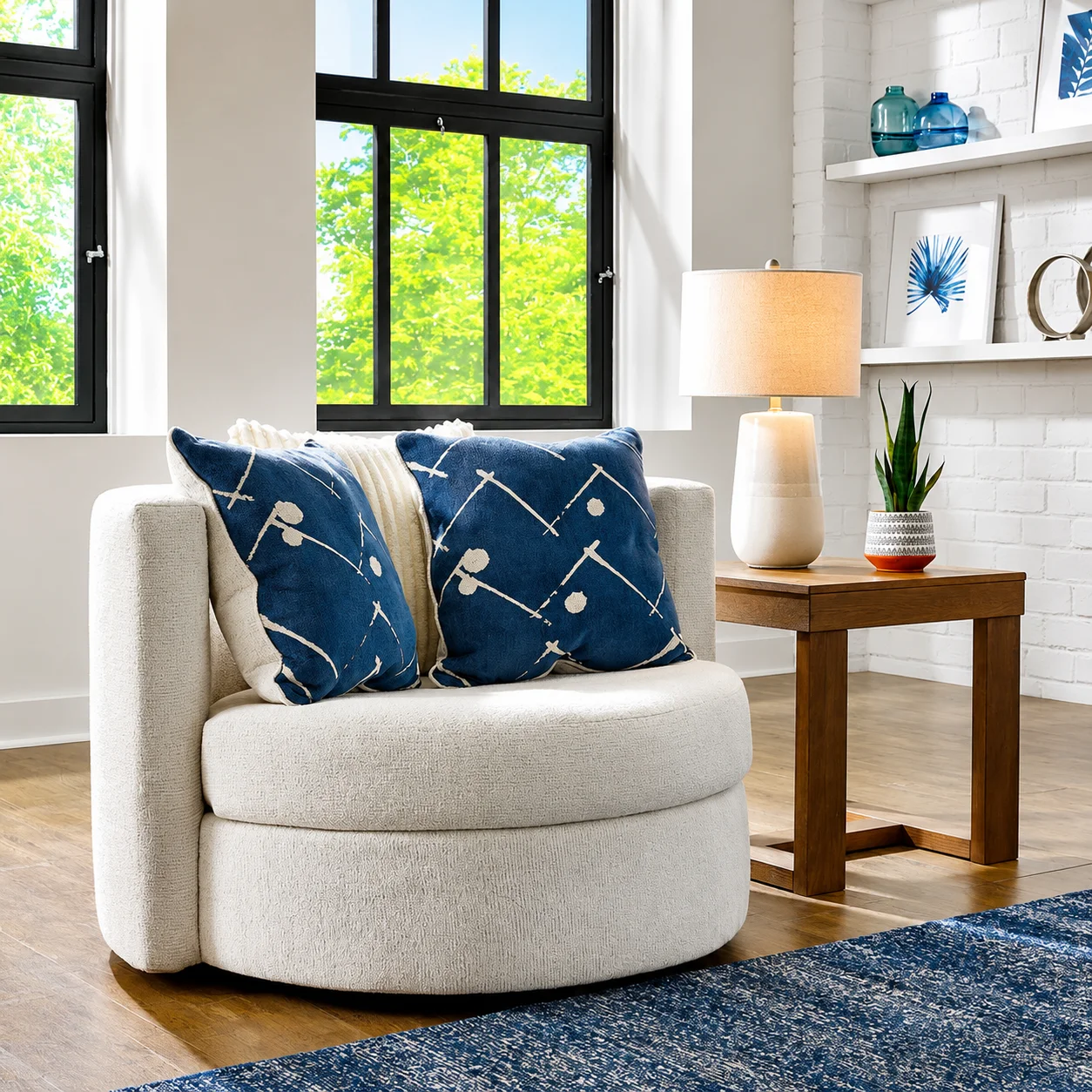 Ashley Padova Swivel Chair in a bright modern living room with blue accent pillows and neutral decor
