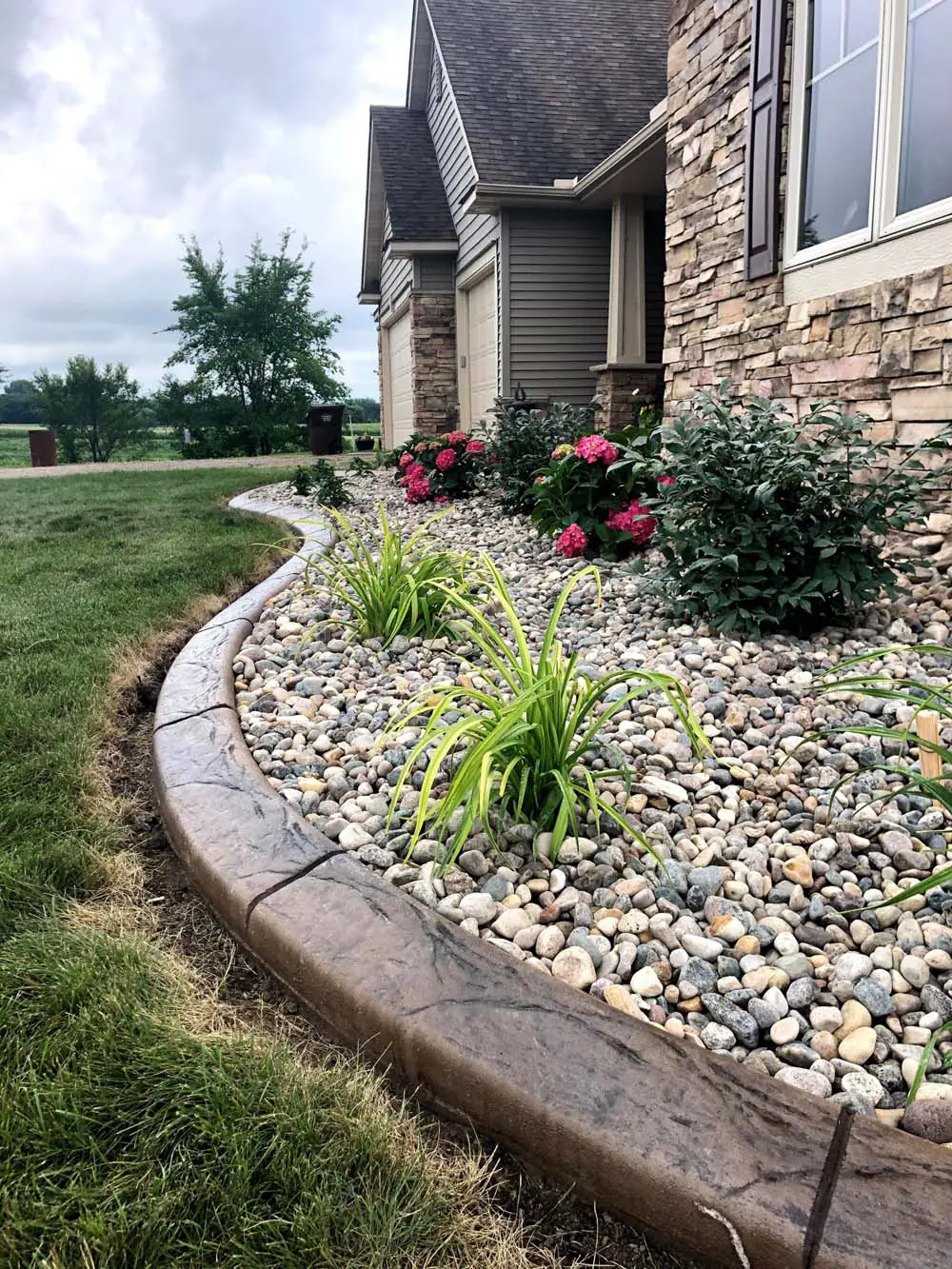 Close-up of KolorScape multicolor river rock showing natural color and size variation, ideal for landscaping, garden beds, and drainage areas
