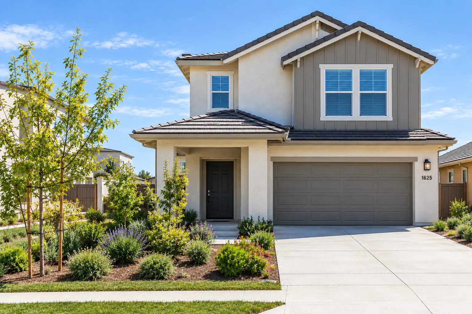 The Aspens Fairhaven Santa Ana home featuring a modern two-story exterior, landscaped front yard, attached two-car garage, and concrete driveway.