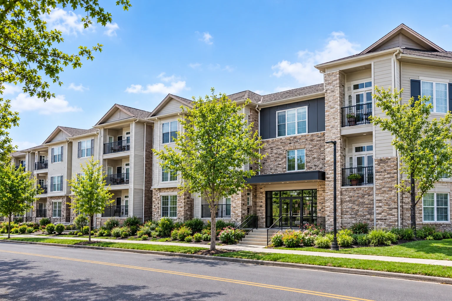 Exterior of a two-story apartment community with parking in Macomb, Illinois